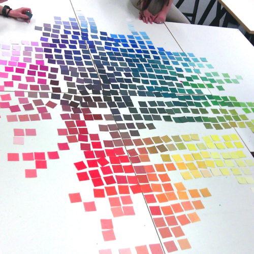 Collection of Square Color Cards Displayed on a Table at Art University