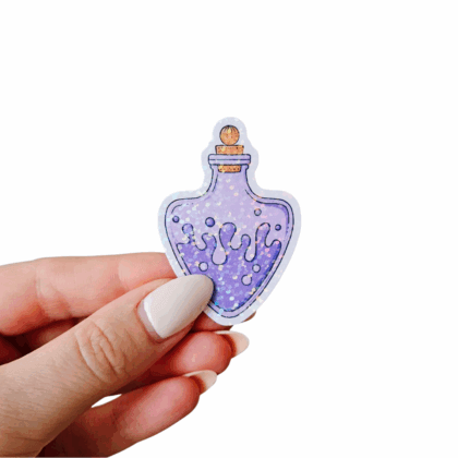 Hand holding a purple potion bottle sticker with a rounded heart-like shape, holographic foil finish, and whimsical bubble and drip pattern. Hand-illustrated fantasy sticker for journals, scrapbooking, or laptop decoration.